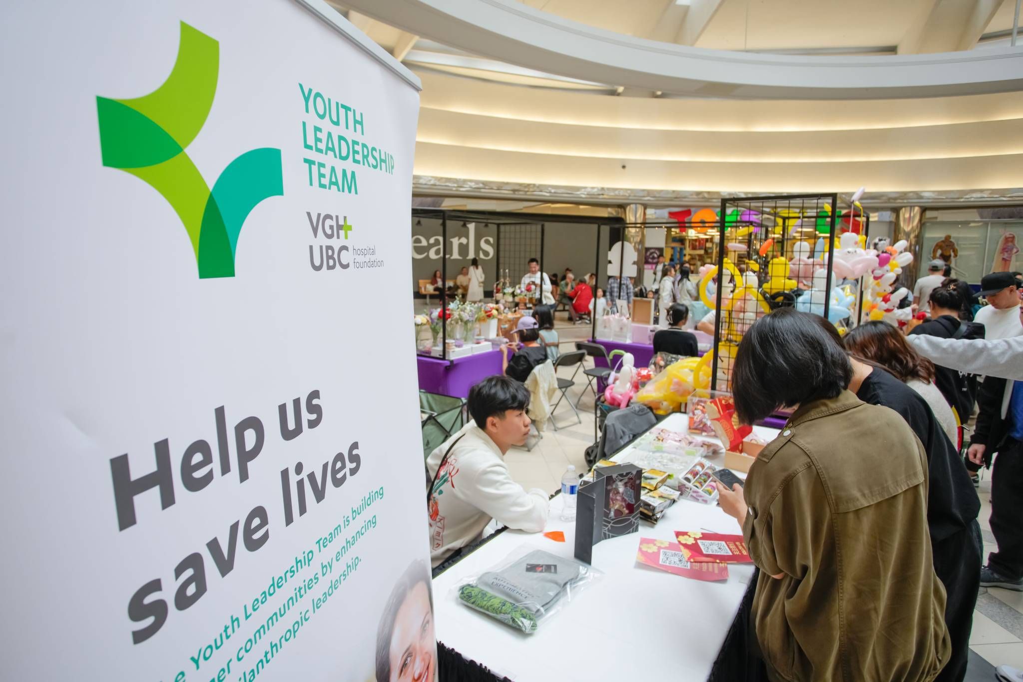 People shop at a Mid-Autumn Festival market.